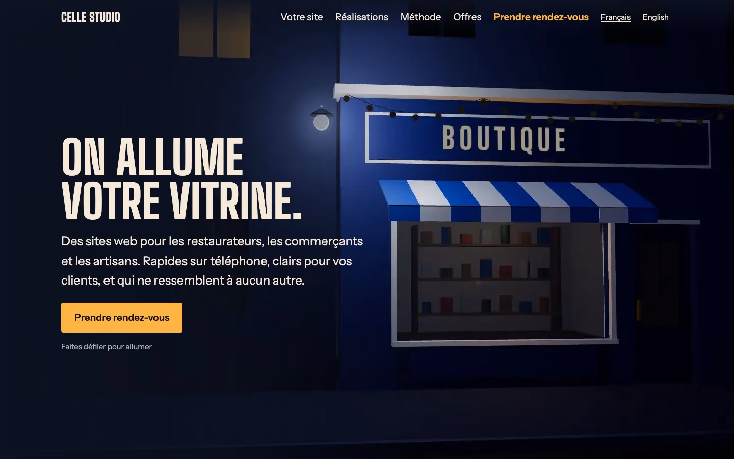 La première version du site du studio : une boutique de nuit et le titre « On allume votre vitrine ».